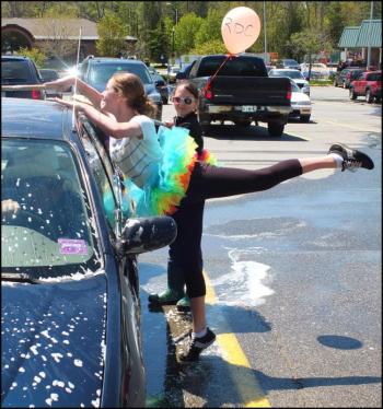 Proper form is important when you dance and wash a car at the same time.