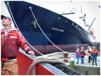 The Belfast-based tug ties up alongside the massive State of Maine in Castine. (Photo by Ethan Andrews)