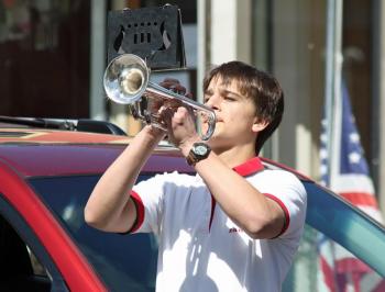 CHRHS band member Aaron Nolan plays taps during Camden's Memorial Day parade.