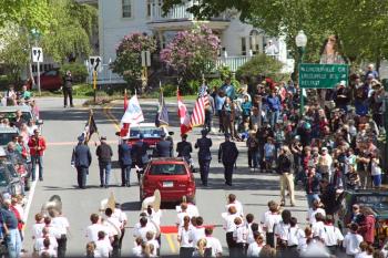 The Memorial Day parade makes it way up Elm Street in downtown Camden, following a stop at adjacent Harbor Park. (Photo by Holly S. Edwards)