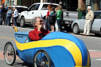 Jory Squibb, known locally as the inventor of micro car 'Moonbeam,' drives electric-assist quadricycle 'Sunbeam' in Camden's Memorial Day parade. (Photo by Holly S. Edwards)