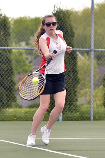 Camden Hills' Camilla Walker returns this serve for a point. (Photo by Ron Hawkes)