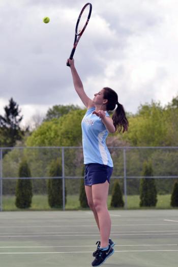 Oceanside's Hannah Lacasse gets her racquet up high to return this violley. (Photo by Ron Hawkes)