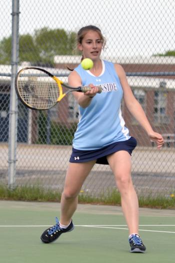 Oceanside's Jackie Thorbjornson returns a serve. (Photo by Ron Hawkes)