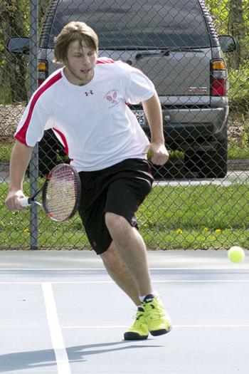 Camden Hills Marc Belley retunrs a volley. (Photo Courtesy of Dwight Pitcairn)