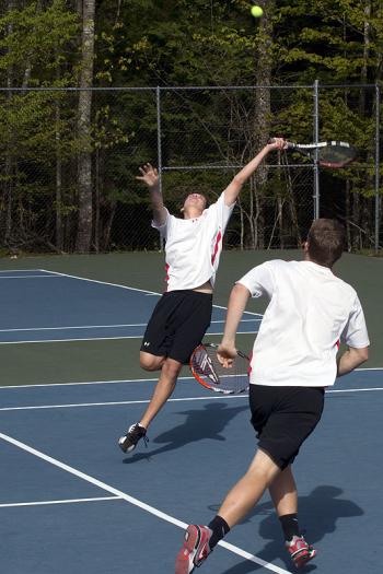 Camden Hills Alex Forcillo Stretching for the ball in the No. 1 doubles match. (Photo Courtesy of Dwight Pitcairn)