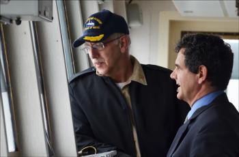 Captain Leslie Eadie III, of Brewer, will take the State of Maine and its roster of Maine Maritime Academy students and staff for a six-week training cruise off the Atlantic coast, down to Tampa, make port in Puerto Rico, before returning back to the homeport of Castine. Captain David Gelinas, himself a graduate of MMA — Class of 1984 — is piloting the ship out of Castine Harbor. It is the way ships leave Maine ports, and they are both teaching another generation how to safely sail the seas in big ships. (Photo by Lynda Clancy).