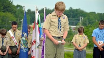 Troop Chaplain's Aide Richard Kinney gives the opening prayer. (Courtesy Leanne M. Robicheau)