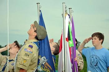 Boy Scouts salute during the raising of the American flag. (Courtesy Leanne M. Robicheau)