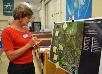 Anita Brosius Scott, of Camden, takes a look at the Riverwalk concept. (Photo by Lynda Clancy)