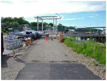 The view on June 18 from the temporary northern end of the Belfast Harbor Walk toward the Armistice footbridge, to which the path is expected to connect by late summer or early fall. (Photo by Ethan Andrews)