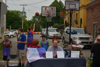 Jason Skarka and some of his Coastal Surge basketball club members promoting the club and the game of basketball. (Photo by Ron Hawkes)