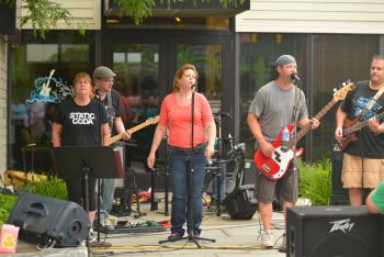 Local rock band Static Coda played outside the Key Bank. (Photo by Ron Hawkes)