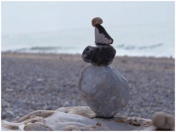 "I practiced the zen exercise of balancing stones in ways that challenge gravity, while André, my host father, practiced the slightly less zen exercise of launching pebbles at my delicate constructions." (Photo by Ari Snider)