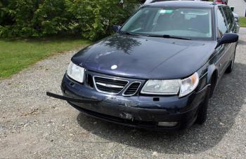 Camden resident Jeffrey Zurkow's Saab stationwagon sustained minimal damage from the impact of the oncoming motorcycle Monday. (Photo by Holly S. Edwards)