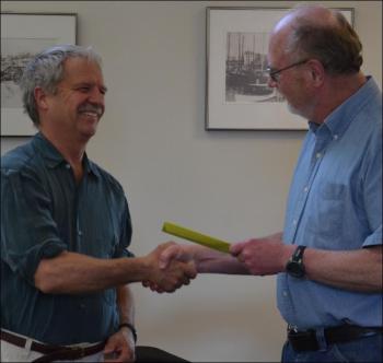 Tom Ford, on left, receives a letter of congratulations from Rockport Select Board Chairman William Chapman. (Photo by Lynda Clancy)