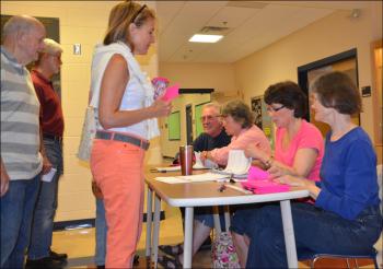 Election wardens and volunteers check in residents and voters. Seated, Wallace and Diane O'Brien, Vicki Eugley and Lois Lyman. Standing is Christine Burstein.