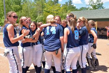 Smiles and tears of joy overwhelm the players on the Oceanside softball team after the big win. (Photo by Ron Hawkes)
