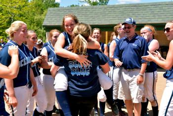 JV coach Rachel Campbell picks up Maggie Drinkwater and spins here around to the joy of everyone else. (Photo by Ron Hawkes)