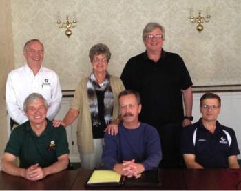 Camden First Aid and North East personnel: Back row: Dennis Brockway, North East president; Julia Libby, Camden First Aid service chief; Kevin McGinnis, chief, North East; seated: Steve Corson, Chairman of the Board, Camden First Aid; Neil Courtney, Camden First Aid board vice chairman; and Dennis Simmons, Rockport Division Commander, North East.