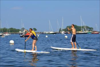Ashleigh and Eric Verite take advantage of a hot July 4 in Camden to paddle. (Photo by Lynda Clancy)