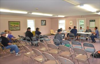The July 8 Owls Head Volunteer Fire Company Board of Directors meeting was attended by residents, fire personnel, the media and selectmen. (Photo by Lynda Clancy)