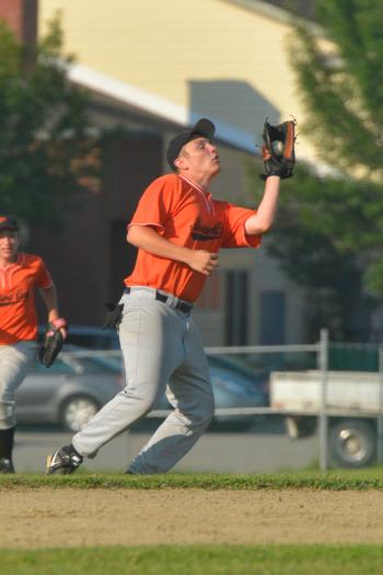 Rockland's Zach Peaco makes the catch n a high fly ball to shortstop. (Photo by Ron Hawkes)