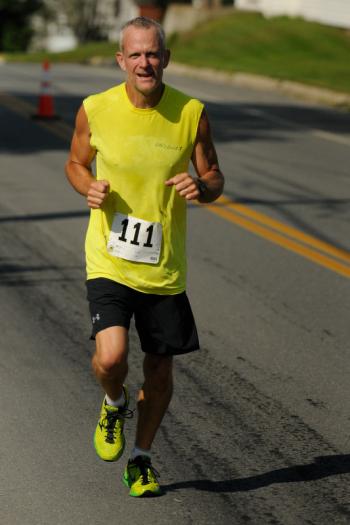 Many of the runners struggled coming up the steep hilss out of Port Clyde, but once thay got past it it was all downhill. (Photo by Ron Hawkes)