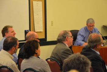 William Kelly, at table, is Camden's town attorney. He advised the planning board of its quasi-judicial responsibilities and to be transparent in all of its proceedings. (Photo by Lynda Clancy)