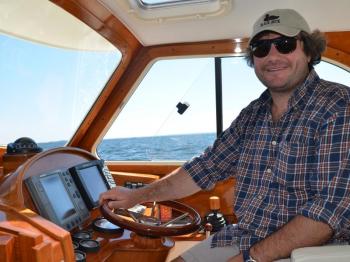 Jared Cummings, owner of the Osprey, a charter boat based in Camden, captains one of the chase boats. (Photo by Lynda Clancy)