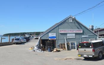 The Monhegan Boat Line's building is being repaired Aug. 12 by J. Richardi Construction. (Photo by Lynda Clancy)