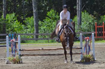 Katherine Orne warming up for a competition at the Stonewall Stables in Nobleboro Saturday. (Photo by Ron Hawkes)