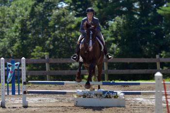 Katherine Orne riding in a competition at the Stonewall Stables in Nobleboro Saturday. (Photo by Ron Hawkes)