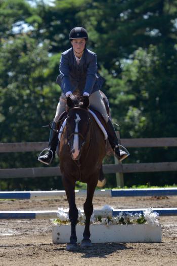 Katherine Orne riding in a competition at the Stonewall Stables in Nobleboro Saturday. (Photo by Ron Hawkes)