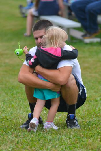 Lots of hugs for lots of people. (Photo by Ron Hawkes)
