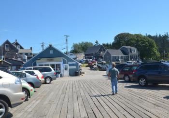 A view up the hill from the end of the wharf, where cars were parked Sunday afternoon, Aug. 11. (Photo by Lynda Clancy)