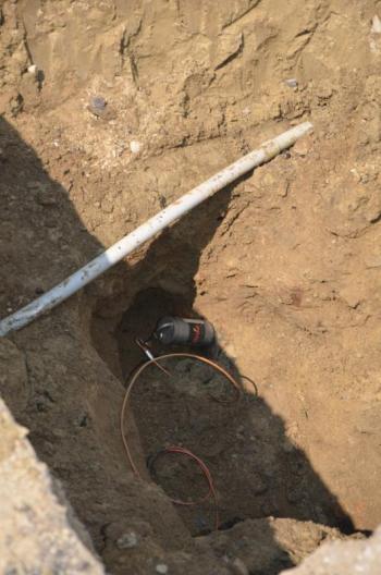 A magnetic resonator differentiates the pulsations of water, between a washing machine and a water meter, helping to locate the intermittent sounds of a pipe leak. (Photo by Lynda Clancy)