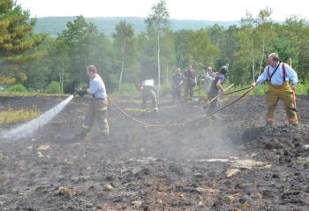 Neal Bartley, on the nozzle, with Lt. Bill Lane. (Photo by Lynda Clancy)