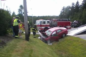 A Toyota sedan caught fire and was demolished in a two-vehicle crash on Route 1 in Waldoboro, Aug. 11. (Photo by Mike Scarborough)