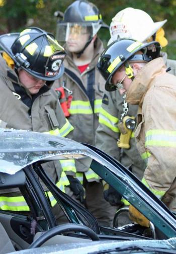 Young firefighters and access team members learn how to use the powerful tools of the job. (Photo by Holly S. Edwards)