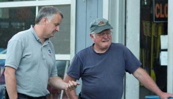 Camden Fire Chief Chris Farley and retired Rockport Fire Chief Bruce Woodward chat while watching Tuesday night's extrication training. (Photo by Holly S. Edwards)