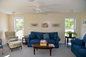 This is a wonderful room to sit, read a book, have a cup of coffee and relax. Comfortable sitting, nice light and great view. Will be able to see the water in the fall-spring time. (Photo by Ron Hawkes)