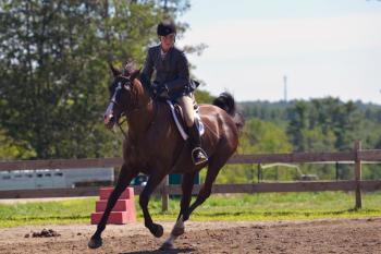 Katherine Orne riding in a competition at the Stonewall Stables in Nobleboro Saturday. (Photo by Ron Hawkes)