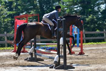 Katherine Orne riding in a competition at the Stonewall Stables in Nobleboro Saturday. (Photo by Ron Hawkes)