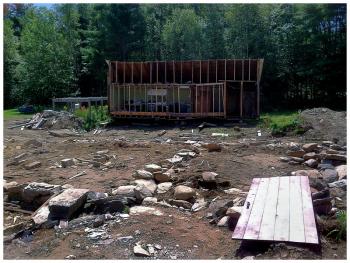 The site on Route 137 where the East Knox School stood for over a century. A later addition to the building was left behind when the building was moved Monday. (Photo by Ethan Andrews)