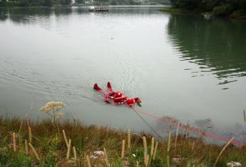 Tethered together at the end of nearly 600 feet of rope, South Thomaston Fire Chief Bryan Calderwood and firefighter Colby Miles float along the surface of the Weskeag River as firefighters on shore pull them in during water rescue training July 29. (Photo by Holly S. Edwards)