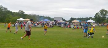 Hundredd and hundreds of members of the Midcoast community flocked to the Warren Athletic Fields Thursday to celebrate the life of Laken Kyle Harrington, and give tremendous support and love to the Harrington family. (Photo by Ron Hawkes)