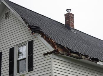 Roof damaged by a fallen tree in Camden. (Photo by Holly S. Edwards)