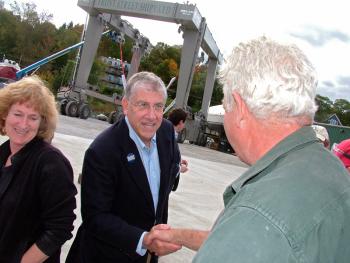 Independent candidate for governor, Eliot Cutler, greets workers at Front Street Shipyard during a swing through the Midcoast, Thursday. The Shipyard’s new 485-ton travel lift, capable of servicing boats up to 160 feet long, is visible in the background. (Photo by Ethan Andrews)