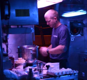 The food is delicious aboard the Eagle, because the cooks care. They bake at night, when the kitchen is quiet. (Photo by Lynda Clancy)